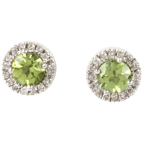 1302 - A pair of 9ct white gold peridot and diamond cluster earrings, with stud fittings, 8.2mm, 2.5g gross