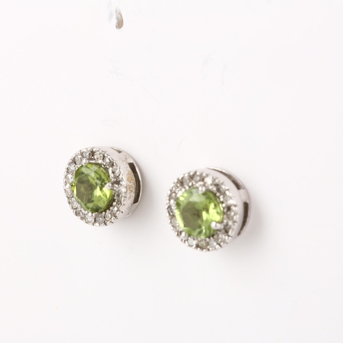 1302 - A pair of 9ct white gold peridot and diamond cluster earrings, with stud fittings, 8.2mm, 2.5g gross