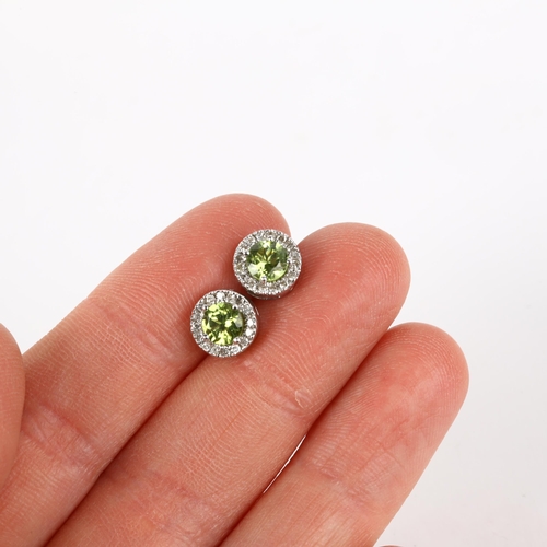 1302 - A pair of 9ct white gold peridot and diamond cluster earrings, with stud fittings, 8.2mm, 2.5g gross