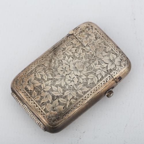 1471 - A Victorian silver Vesta case, George Unite, Birmingham 1883, rectangular form with allover floral e... 