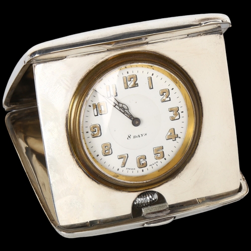 1485 - An Art Deco George V silver 8-day travelling clock, Synyer & Beddoes, white enamel dial with Arabic ... 