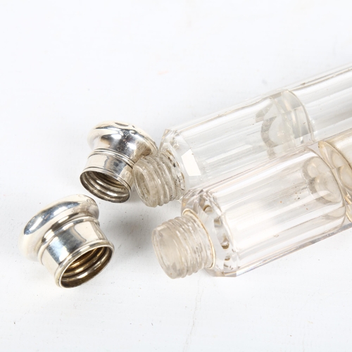 1517 - A graduated pair of glass double-ended travelling scent bottles, unmarked white metal mounts, larges... 