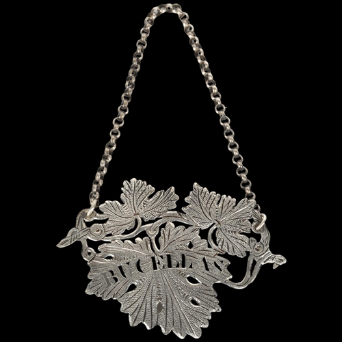 1526 - A George IV silver 'Bucellas' grapevine wine decanter label, Ledsan Vale, Birmingham 1827, width 8.5... 