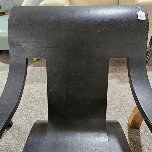 25 - A single sheet bent plywood chair, in the manner of Gerald Summers, black painted, applied label und... 