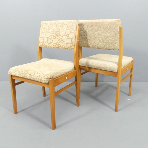 2032 - A set of four mid-century teak and upholstered dining chairs with drop in seats, Impressed GDR.