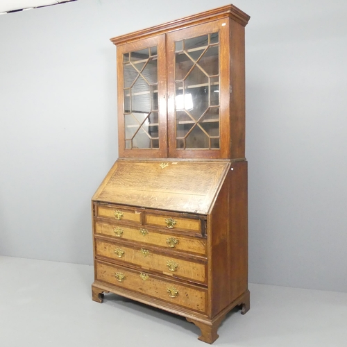 2116 - A 19th century oak two-section bureau bookcase, having two lattice glazed doors, the fall-front reve... 