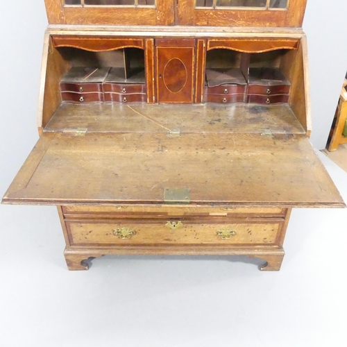 2116 - A 19th century oak two-section bureau bookcase, having two lattice glazed doors, the fall-front reve... 