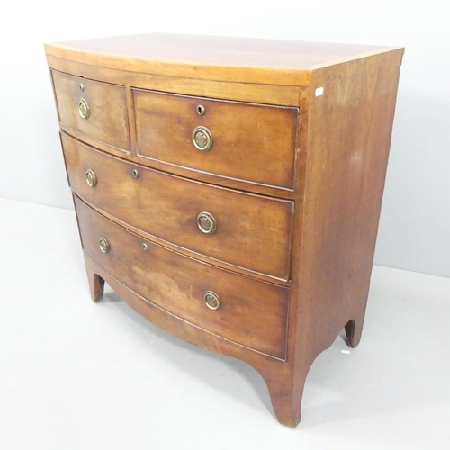 2121 - A Georgian crossbanded mahogany and ebony strung bow-front chest of two short and two long drawers. ... 