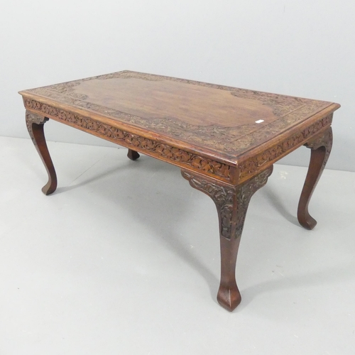 2122 - A continental style hardwood coffee table, with carved decoration and raised on cabriole legs. 102x4... 