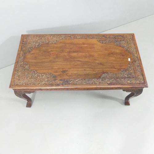 2122 - A continental style hardwood coffee table, with carved decoration and raised on cabriole legs. 102x4... 