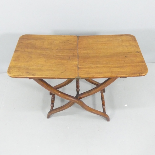 2129 - A Victorian mahogany folding coaching table on X-framed base. 86x69x41cm.