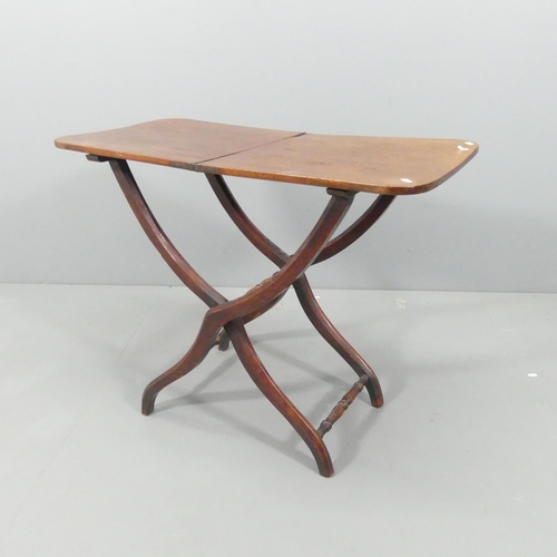 2130 - A Victorian mahogany folding coaching table on X-framed base. 89x71x46cm.