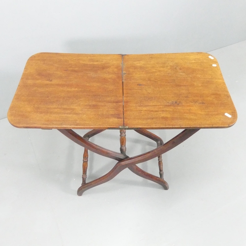 2130 - A Victorian mahogany folding coaching table on X-framed base. 89x71x46cm.