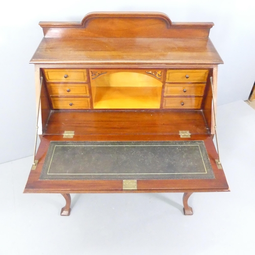 2146 - An early 20th century mahogany bureau, with inlaid shell decoration, the fall front revealing a fitt... 