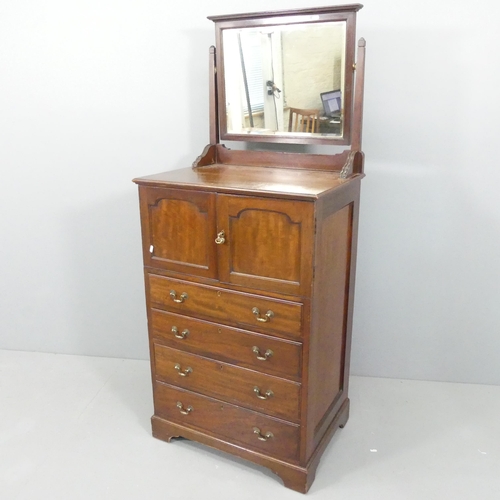 2151 - A late Victorian linen press of small form, with raised mirror back, two panelled doors revealing a ... 