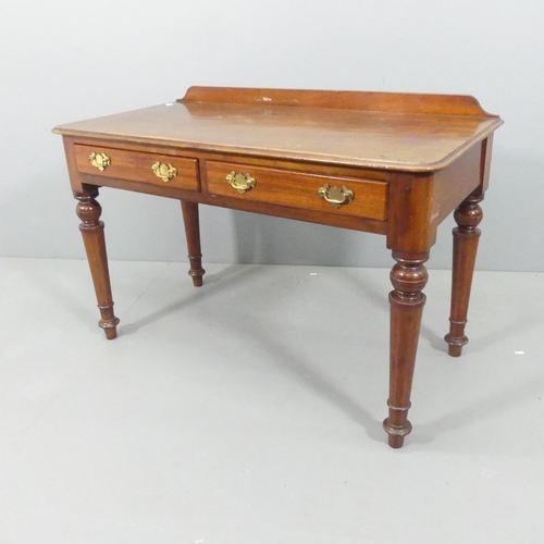 2155 - EDWARDS AND ROBERTS - A Victorian mahogany writing table, with raised back, two drawers and raised o... 