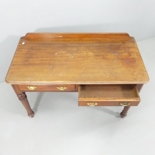 2155 - EDWARDS AND ROBERTS - A Victorian mahogany writing table, with raised back, two drawers and raised o... 