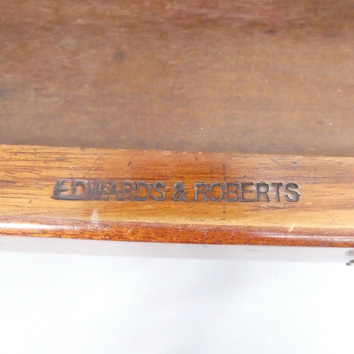 2155 - EDWARDS AND ROBERTS - A Victorian mahogany writing table, with raised back, two drawers and raised o... 