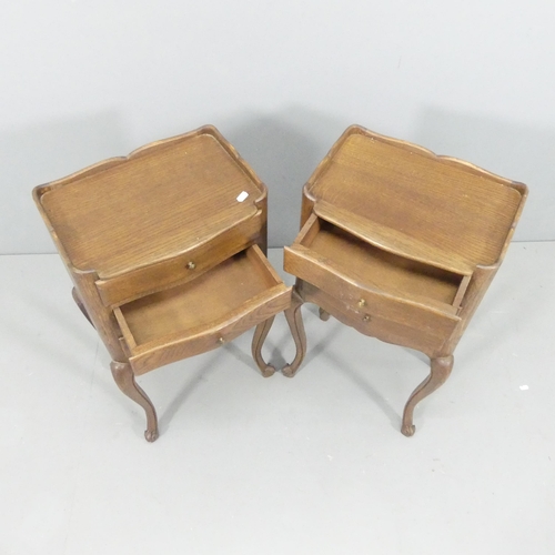 2156 - A pair of French oak three-drawer bedside tables with cabriole legs. 74x74x29cm.