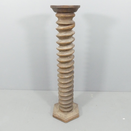 2157 - A French elm spiral turned column on hexagonal base. 33x128cm.