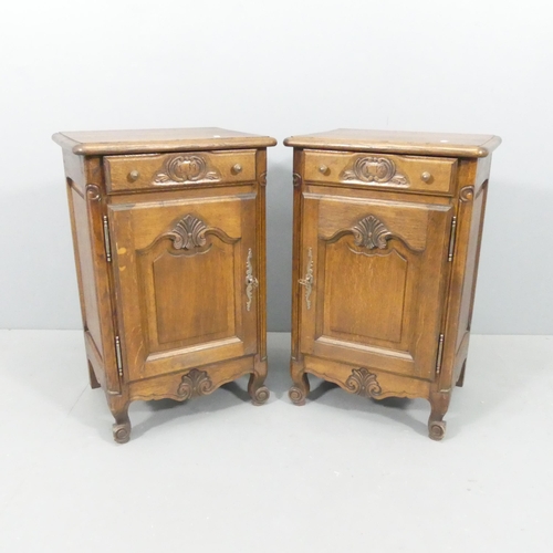 2162 - A pair of French oak pot-cupboards, with single frieze drawer and carved and panelled decoration. Ea... 