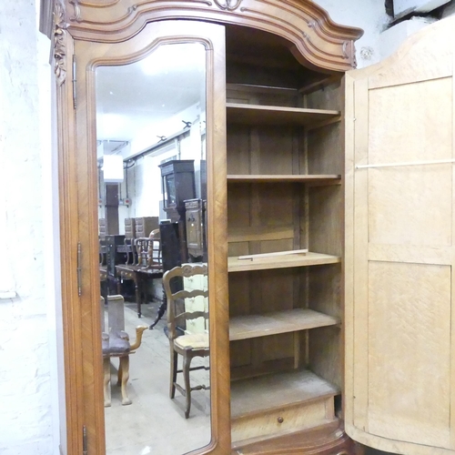 2167 - A French kingwood veneered arch-top armoire, with two mirror doors, shelf fitted interior and applie... 