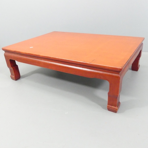 2173 - A Chinese red-laquered rectangular low coffee table. 106x133x75cm.