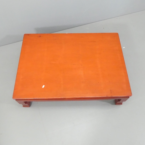 2173 - A Chinese red-laquered rectangular low coffee table. 106x133x75cm.