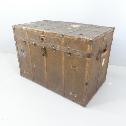 2174 - An antique leather covered and brass mounted trunk, labelled ER to side. 103x71x58cm