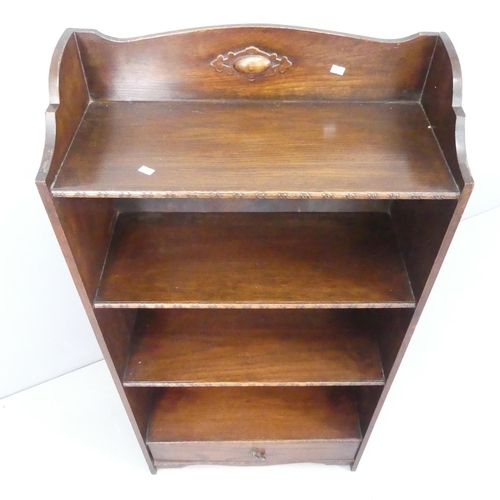 2175 - A 1930s oak open bookcase, with fixed shelves and drawers under. 60x120x26cm.