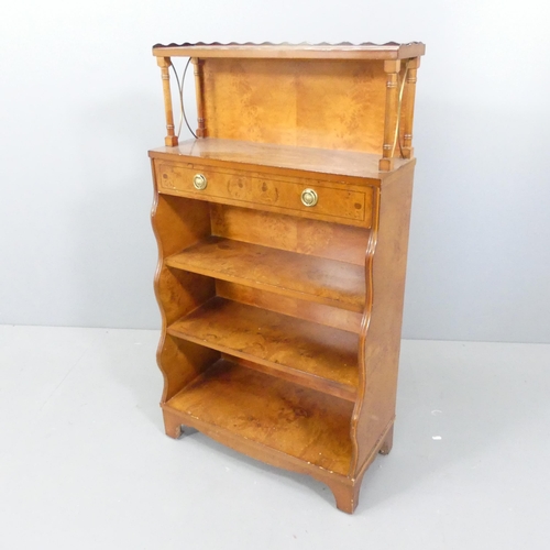 2176 - A walnut and ebony strung open bookcase, with fixed shelves and single drawer. 62x109x29cm.