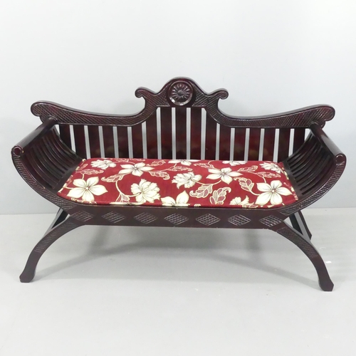 2178 - An Anglo-Indian style hardwood and upholstered two-seater window seat with carved decoration. 132x76... 