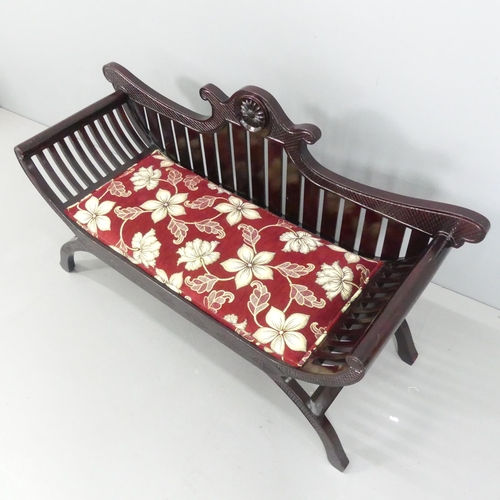 2178 - An Anglo-Indian style hardwood and upholstered two-seater window seat with carved decoration. 132x76... 