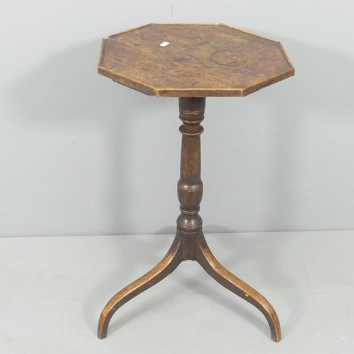 2186 - An antique oak octagonal top wine table, with turned central column and tripod base. 41x71cm.