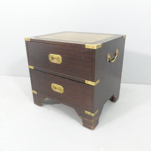 2187 - A modern small campaign style chest of two drawers, with brass mounts and inset embossed green leath... 