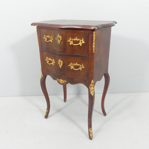 2189 - A continental style mahogany bedside chest of two drawers, with brass mounts and raised on cabriole ... 