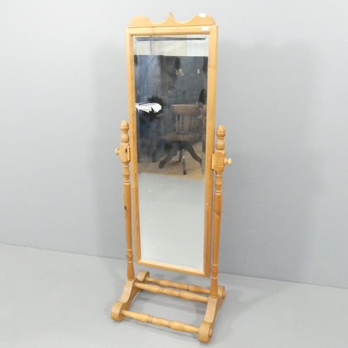 2193 - A Victorian style pine framed cheval mirror. 56x147cm.