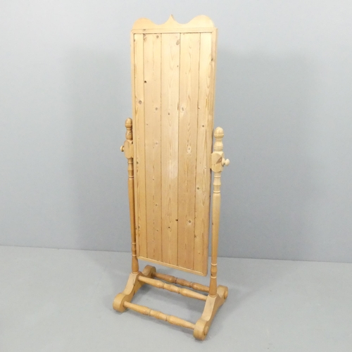 2193 - A Victorian style pine framed cheval mirror. 56x147cm.