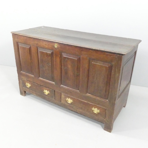 2201 - An 18th century panelled oak mule chest. 130x84x55cm.