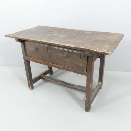 2203 - An antique oak serving table, with two drawers and H-shaped stretcher. 123x77x64cm.