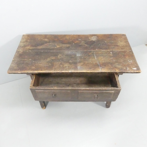 2203 - An antique oak serving table, with two drawers and H-shaped stretcher. 123x77x64cm.