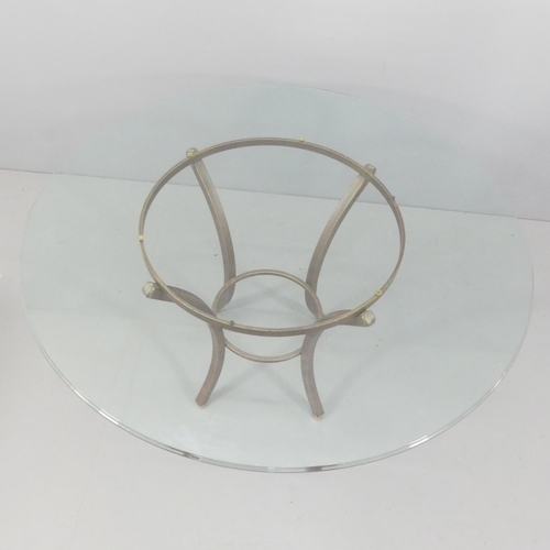 2046 - PIERRE VANDEL - a mid-century design two-tier circular glass top dining table from the Villa d'est c... 