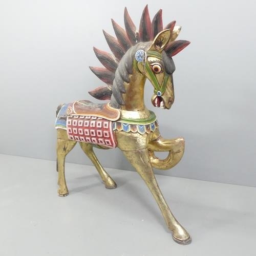 2051 - An Indonesian hand painted and gilded wooden horse. 137x132x44cm.