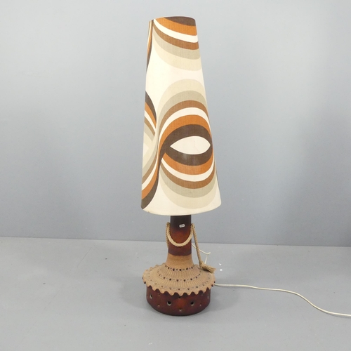 2057 - A mid-century West German pottery floor lamp with original shade. Height overall 134cm.