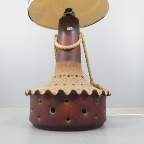 2057 - A mid-century West German pottery floor lamp with original shade. Height overall 134cm.