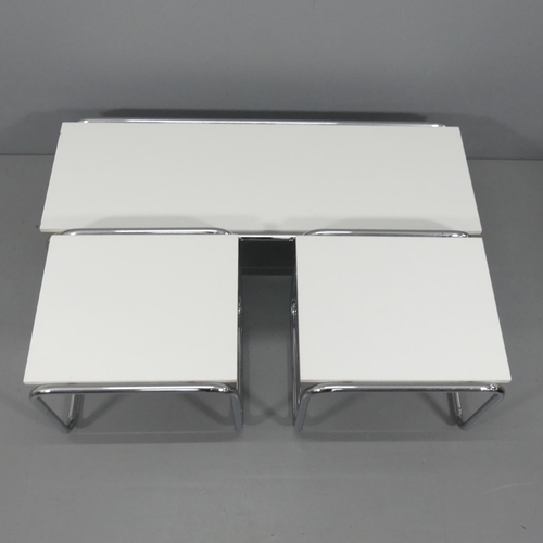 2065 - A set of three tubular steel modernist Laccio style coffee tables in the manner of Marcel Breuer.