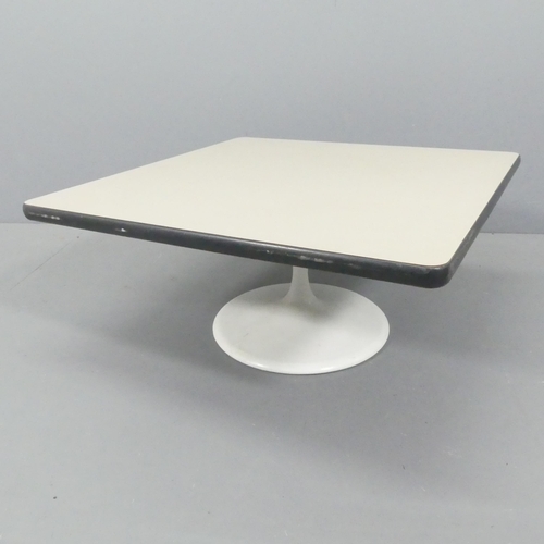 2072 - A contemporary square top coffee table on tulip base, with label for Herman Miller Action Office. 37... 