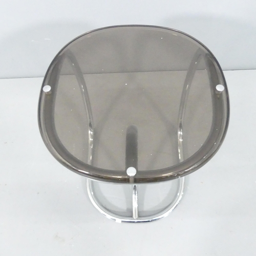 2075 - A 1970s tubular chrome and acrylic side table. 27x36cm.