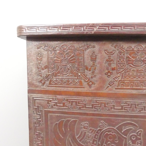 2082 - A mid-century Peruvian tooled leather clad bar, with embossed Aztec design. 143x109x61cm