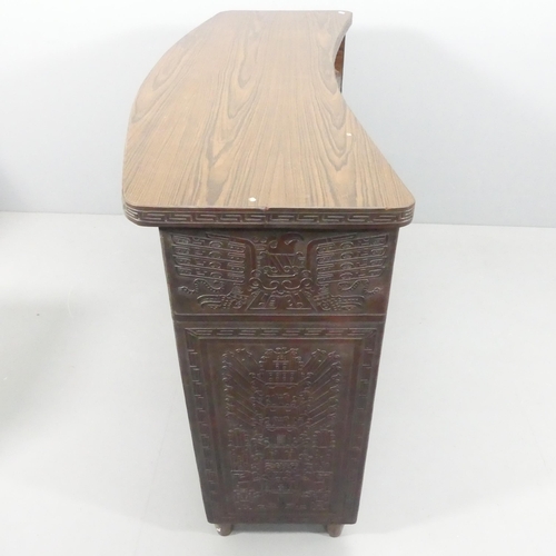 2082 - A mid-century Peruvian tooled leather clad bar, with embossed Aztec design. 143x109x61cm